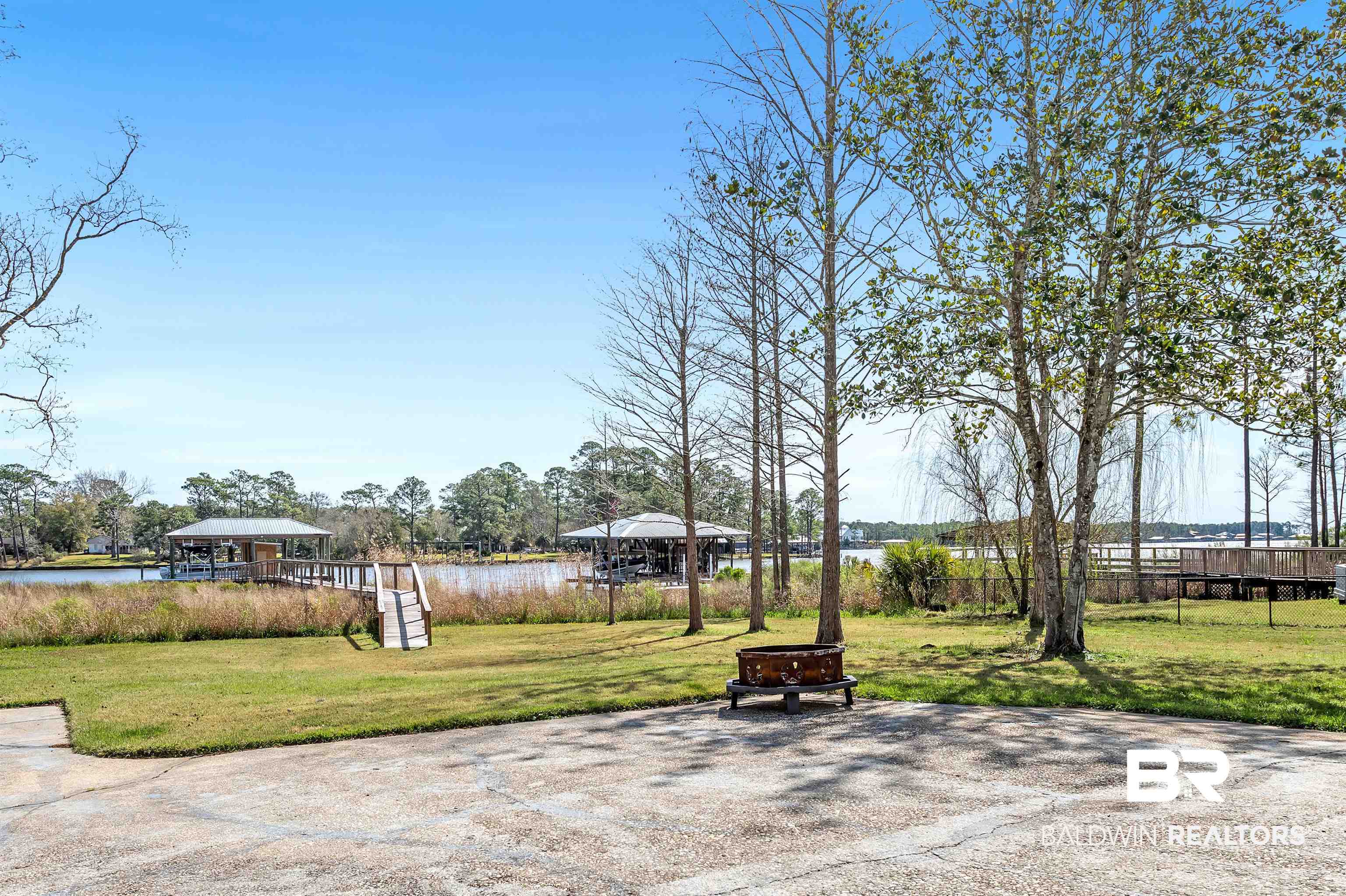 8915 Bay Point Drive Elberta, AL 36530 - Photo 23 of 74 View of home's community with a water view, a yard, an outdoor fire pit, and a gazebo