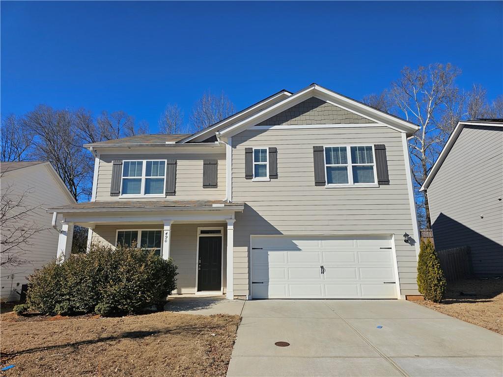 490 Walnut Grv Way Pendergrass, GA 30567 - Photo 1 of 23 a front view of a house with yard