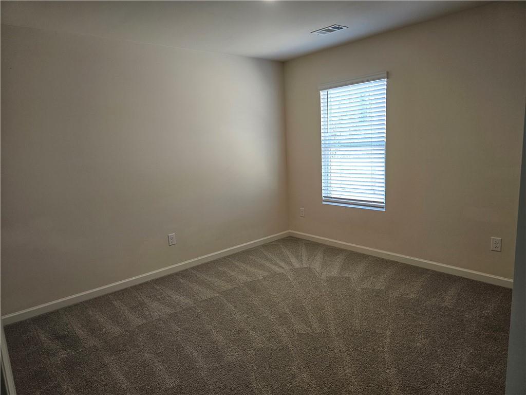 490 Walnut Grv Way Pendergrass, GA 30567 - Photo 15 of 23 an empty room with a window