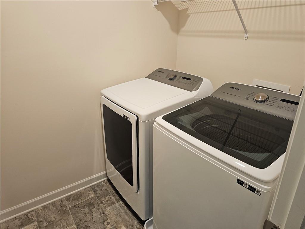490 Walnut Grv Way Pendergrass, GA 30567 - Photo 18 of 23 a utility room with dryer and washer