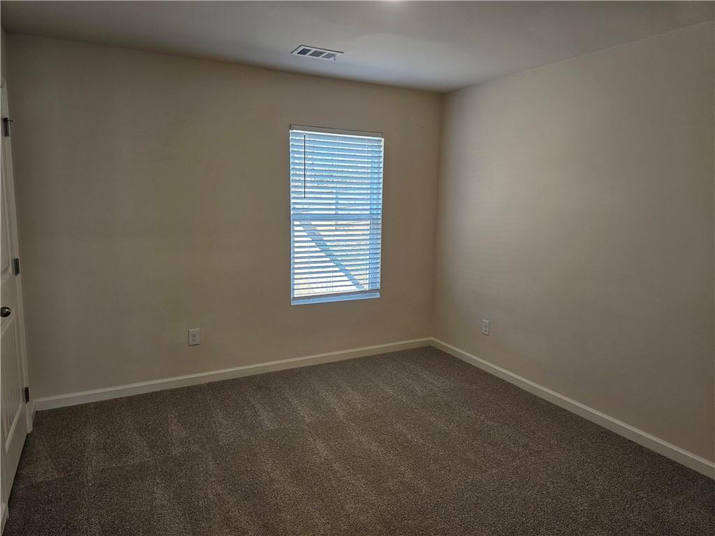 490 Walnut Grv Way Pendergrass, GA 30567 - Photo 19 of 23 an empty room with a window
