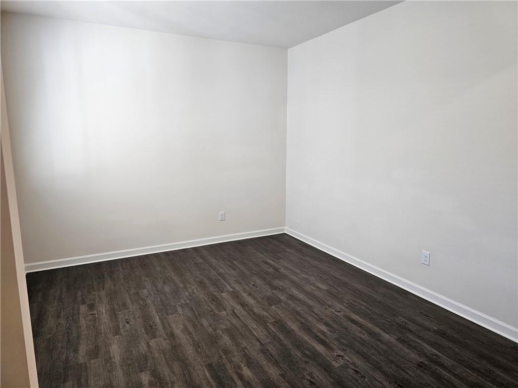490 Walnut Grv Way Pendergrass, GA 30567 - Photo 5 of 23 a view of an empty room with wooden floor