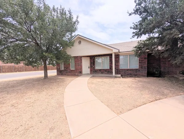 a house with trees in front of it