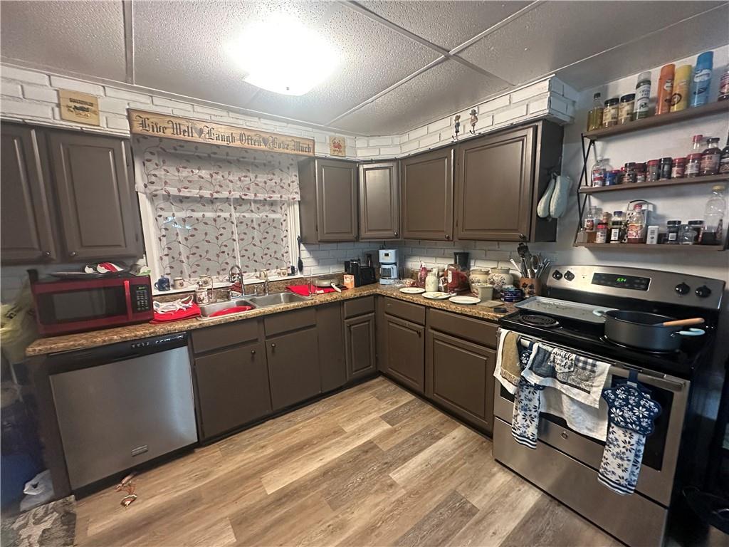 311 South Fourth Street Apollo, PA 15613 - Photo 11 of 27 a kitchen with kitchen island granite countertop a sink cabinets and stainless steel appliances