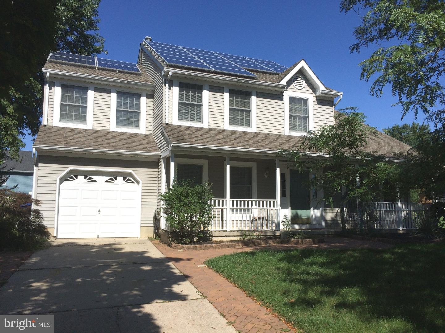 56 Manchester Road Eastampton, NJ 08060 - Photo 1 of 17 a front view of a house with a garden and plants