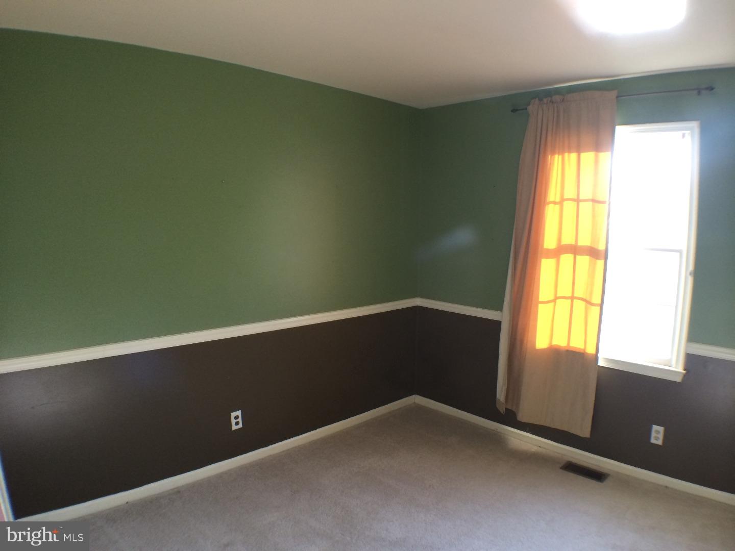 56 Manchester Road Eastampton, NJ 08060 - Photo 3 of 17 a view of an empty room with a window