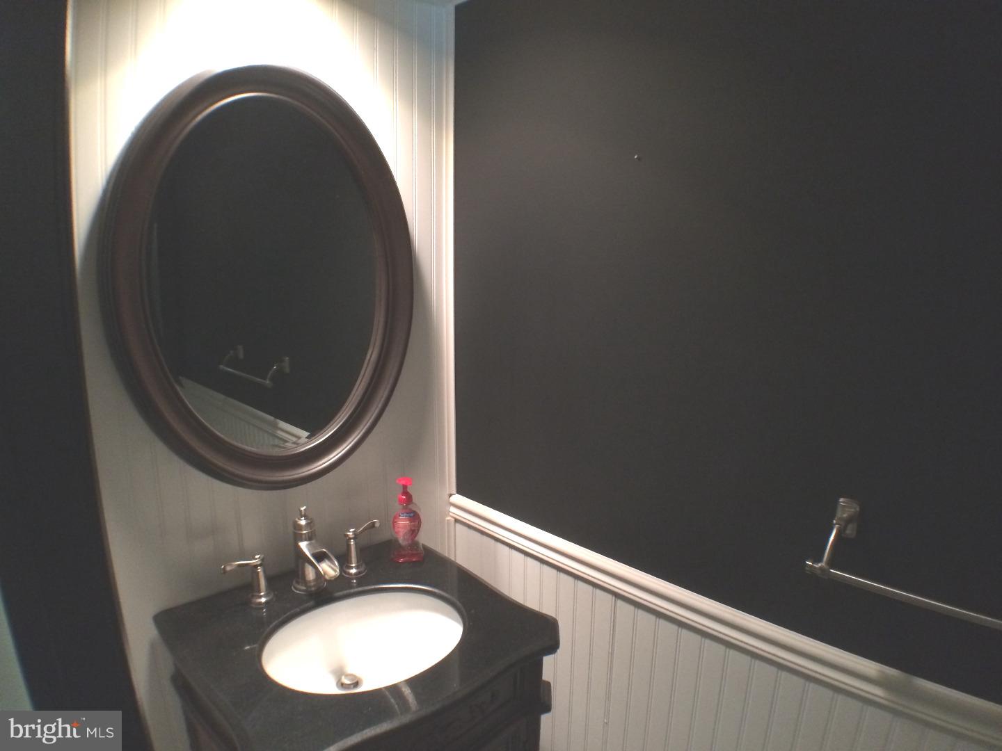 56 Manchester Road Eastampton, NJ 08060 - Photo 5 of 17 a bathroom with a sink and a mirror