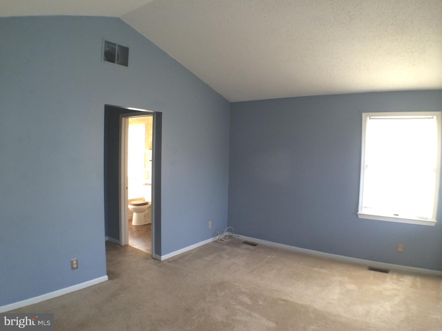 56 Manchester Road Eastampton, NJ 08060 - Photo 6 of 17 an empty room with windows