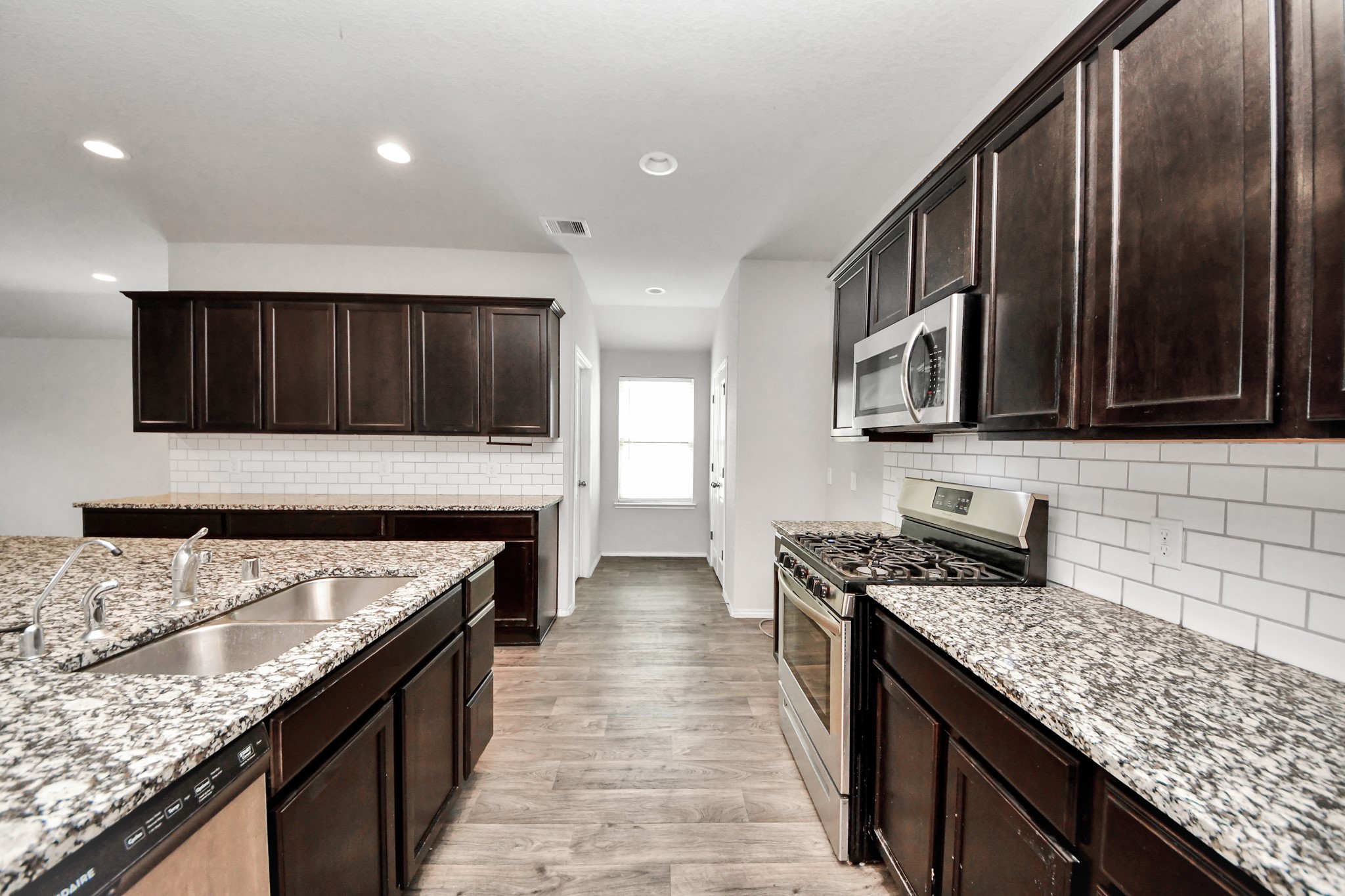 8302 Rose Petals Lane Rosharon, TX 77583 - Photo 10 of 42 Functional kitchen layout with abundant cabinetry