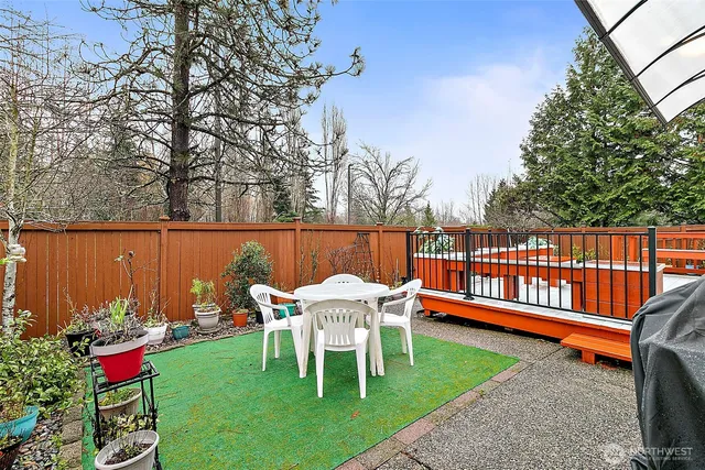 a view of a chairs and table in the garden