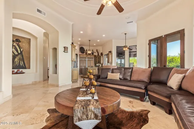a kitchen with stainless steel appliances granite countertop a sink and a refrigerator