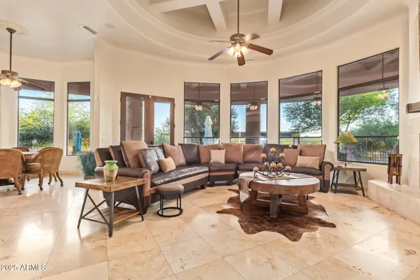 a kitchen with stainless steel appliances granite countertop a kitchen island a stove and a sink