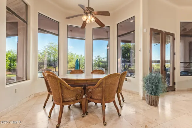 a kitchen that has a lot of cabinets in it and wooden floors
