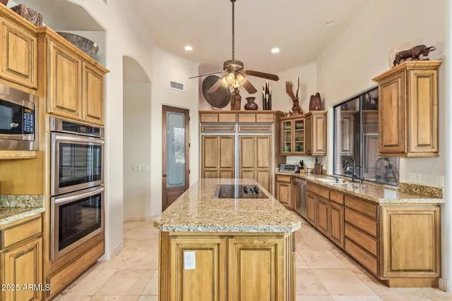 a large bathroom with a granite countertop sink a large mirror and a shower