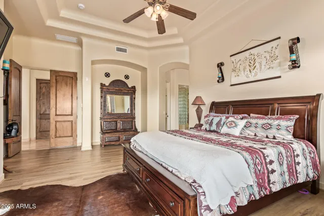 a bathroom with a granite countertop sink toilet mirror and shower
