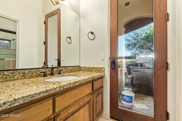 a view of a balcony with table and chairs