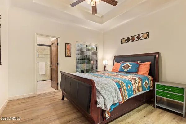 a view of a house with a garden and lake view