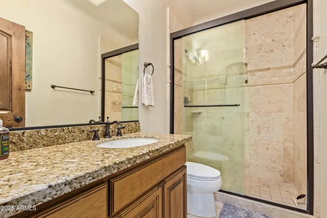 an aerial view of a house with swimming pool and ocean view