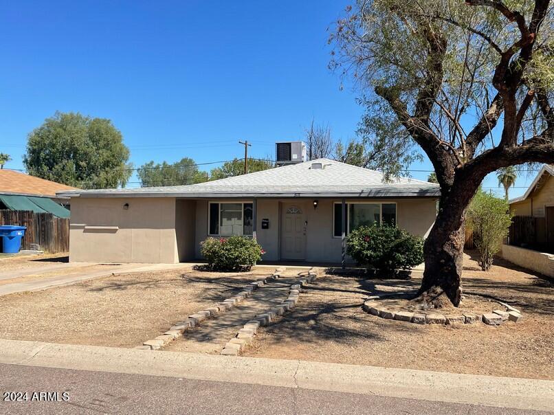 3111 North 34th Street Phoenix, AZ 85018 - Photo 1 of 15 a front view of a house with a yard