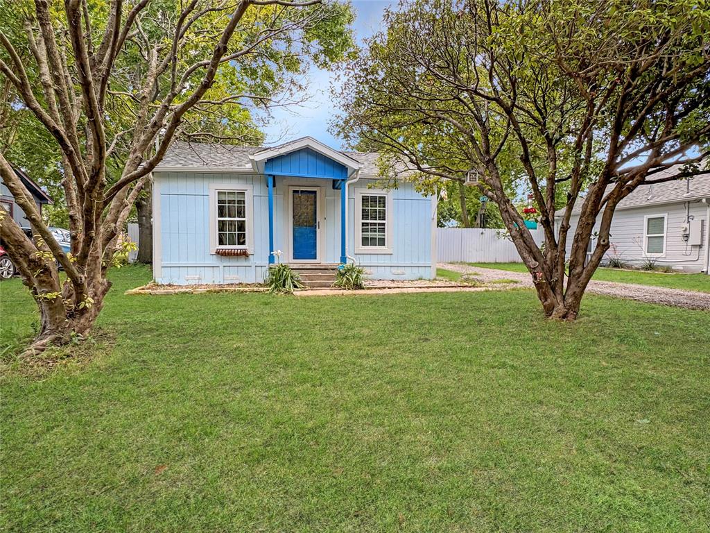 604 Maple Street Howe, TX 75459 - Photo 1 of 16 a front view of a house with garden