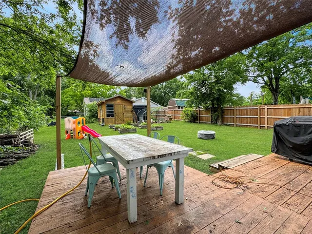 a view of a wooden deck and a patio