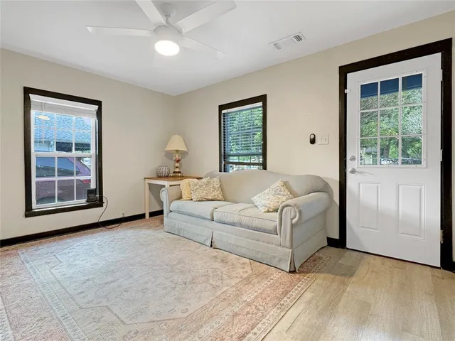 a living room with furniture and a window