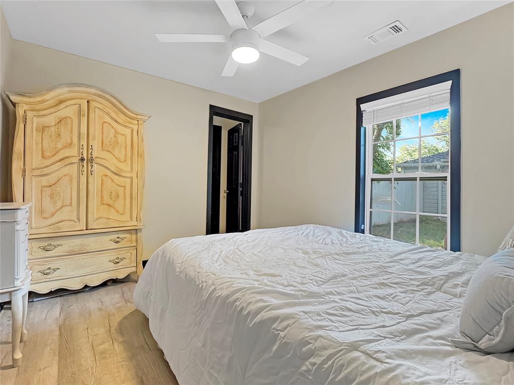 604 Maple Street Howe, TX 75459 - Photo 8 of 16 a bedroom with a bed dresser and a window