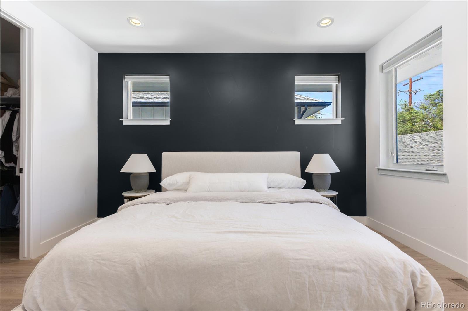 8 South Colorado Boulevard Denver, CO 80246 - Photo 11 of 40 a bedroom with a large bed and a window