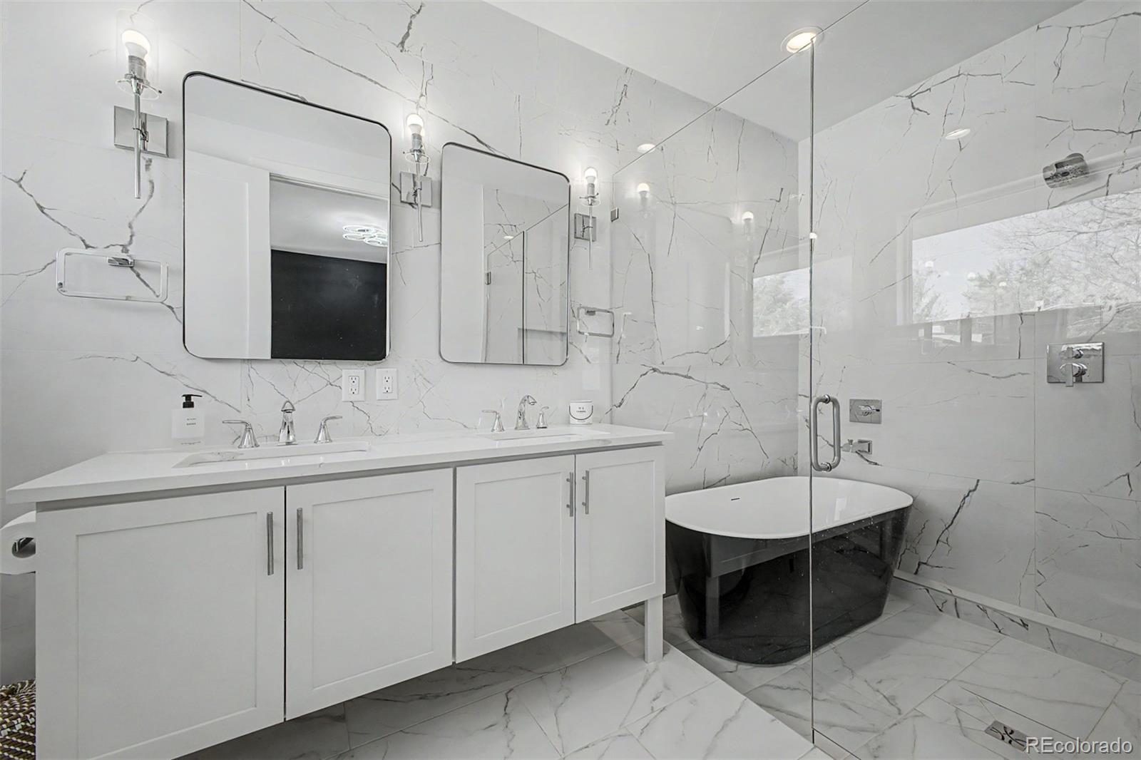 8 South Colorado Boulevard Denver, CO 80246 - Photo 12 of 40 a spacious bathroom with a double vanity sink mirror and bathtub