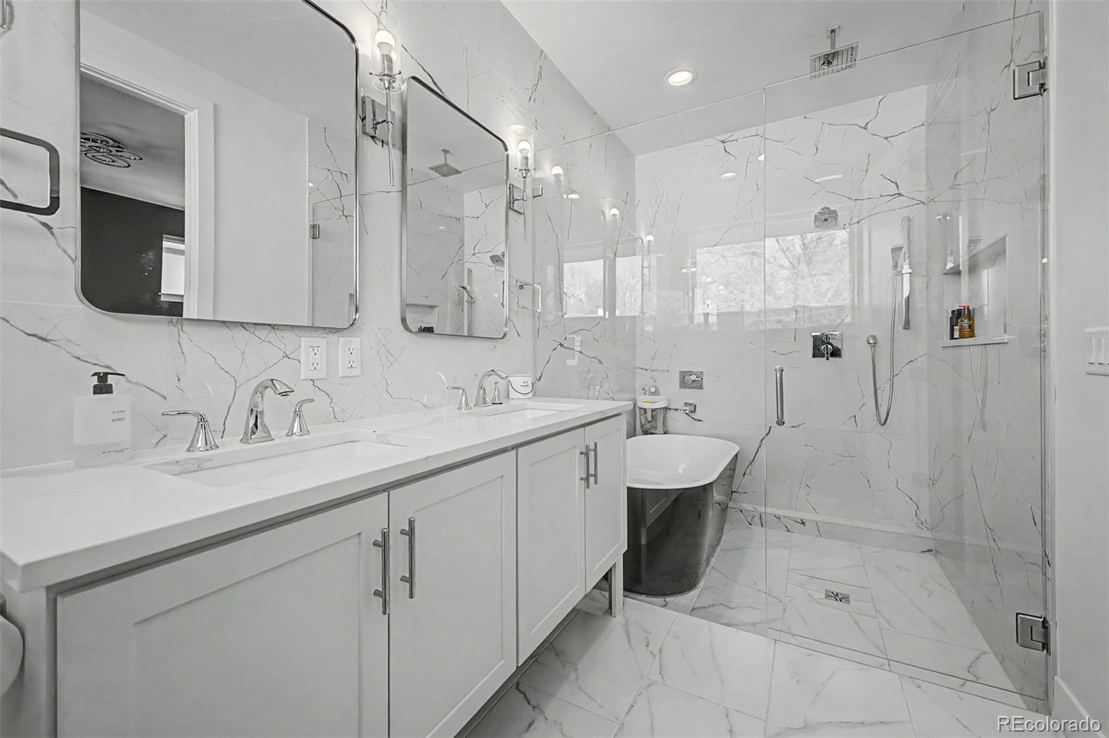 8 South Colorado Boulevard Denver, CO 80246 - Photo 13 of 40 a spacious bathroom with a shower sink double vanity and mirror