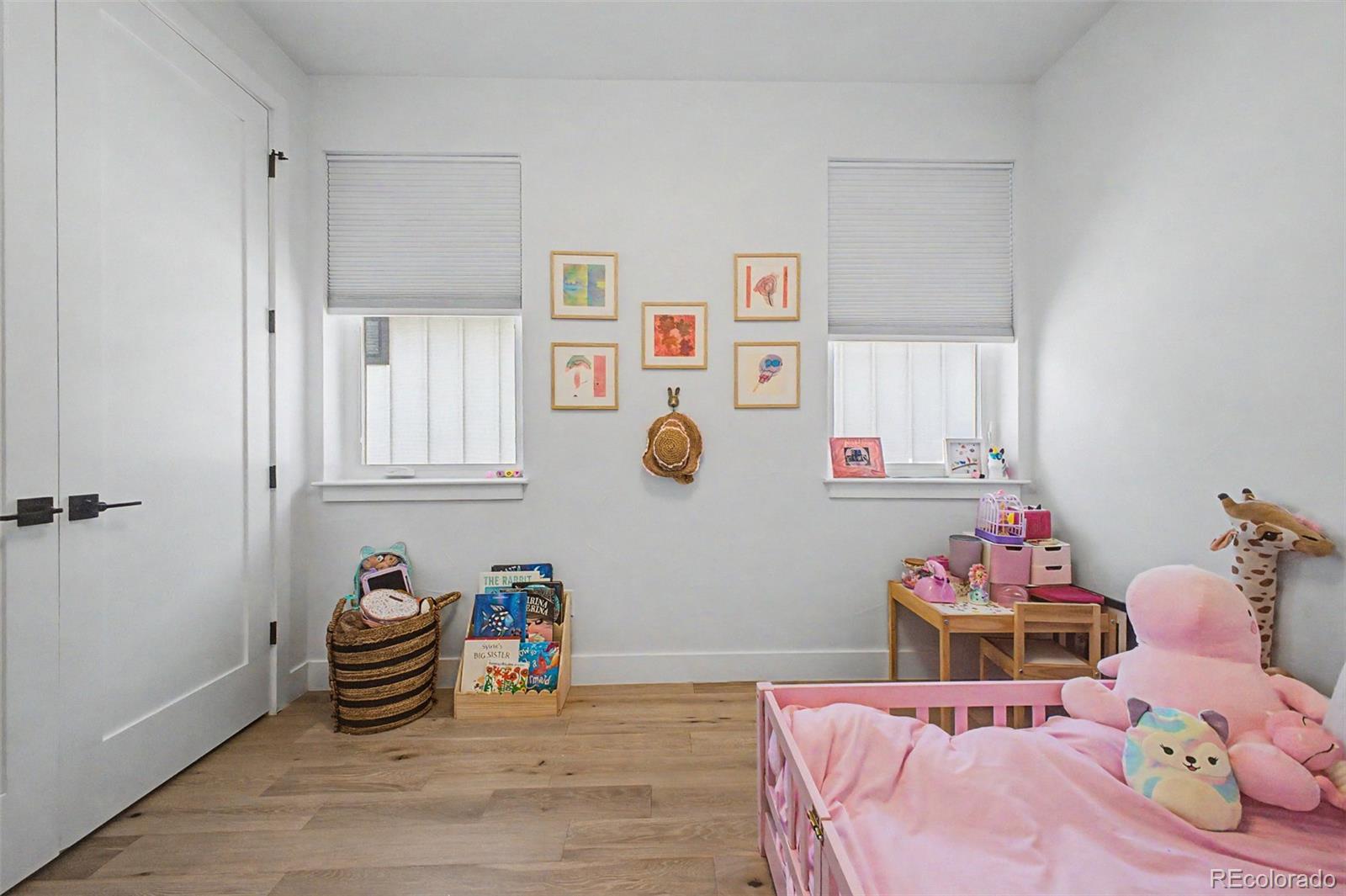 8 South Colorado Boulevard Denver, CO 80246 - Photo 19 of 40 a bedroom with furniture and a potted plant