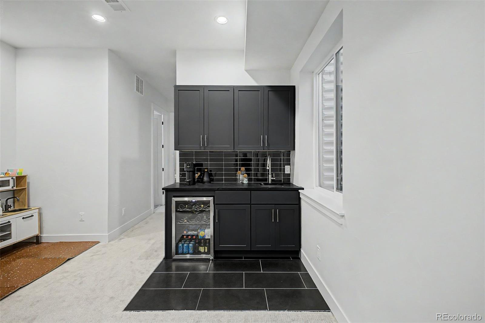 8 South Colorado Boulevard Denver, CO 80246 - Photo 24 of 40 a kitchen with a sink and a stove top oven