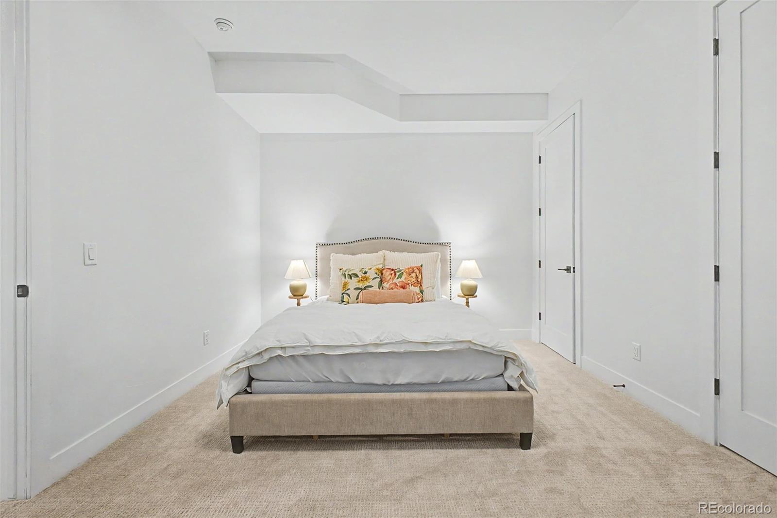 8 South Colorado Boulevard Denver, CO 80246 - Photo 28 of 40 a spacious bedroom with a bed and a shower
