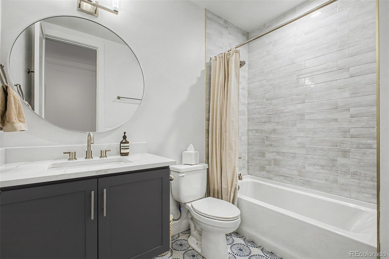 8 South Colorado Boulevard Denver, CO 80246 - Photo 30 of 40 a bathroom with a sink toilet and shower