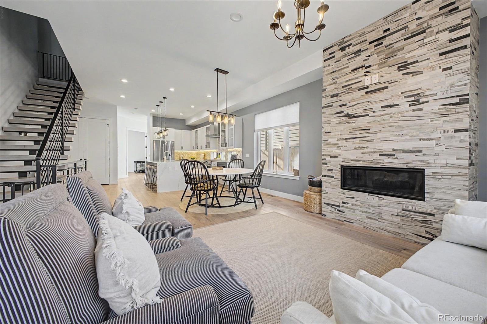 8 South Colorado Boulevard Denver, CO 80246 - Photo 5 of 40 a living room with furniture and a fireplace