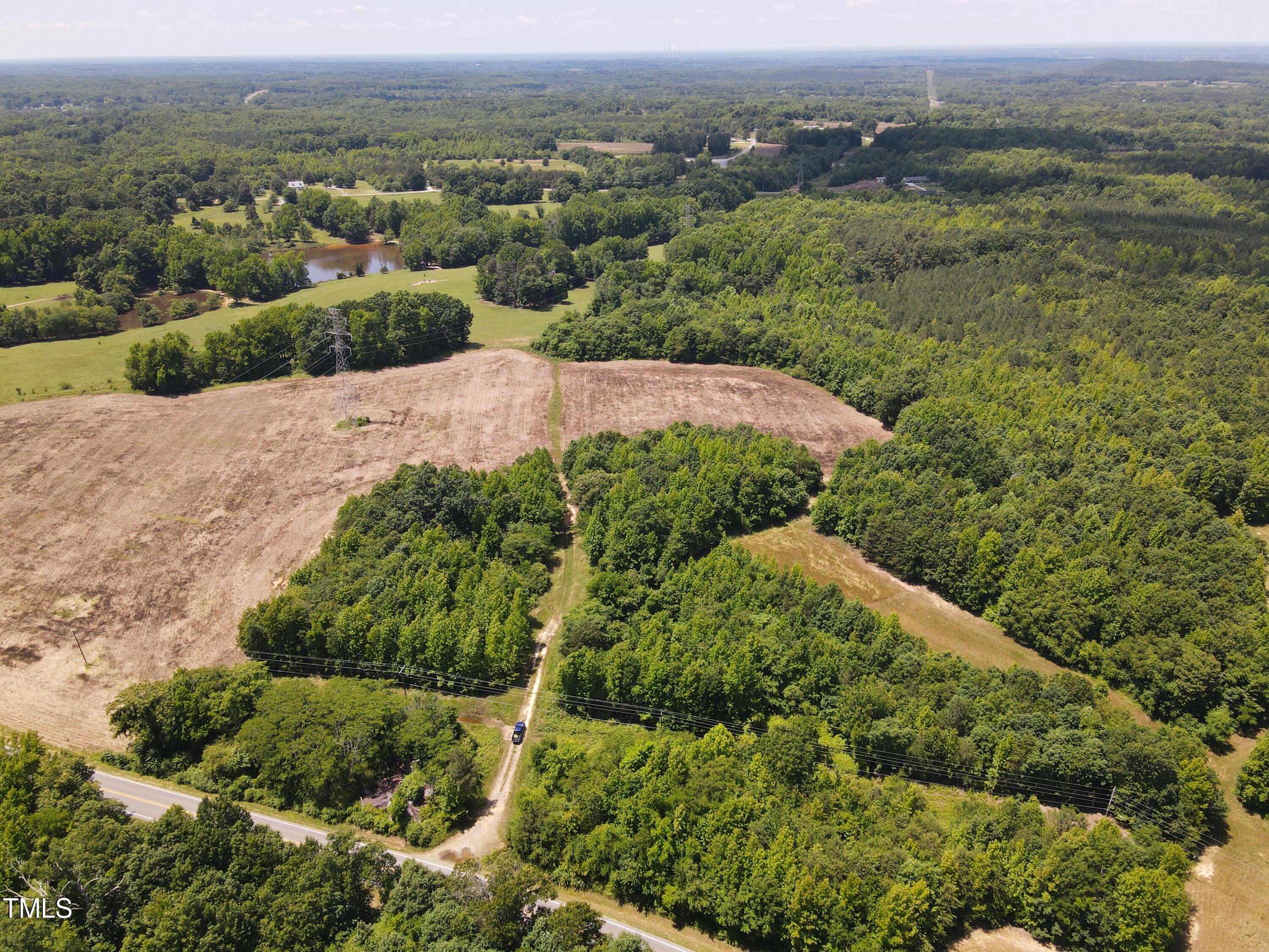 0 Virgilina Road Roxboro, NC 27574 - Photo 13 of 27 an aerial view of a houses with a yard and lake view