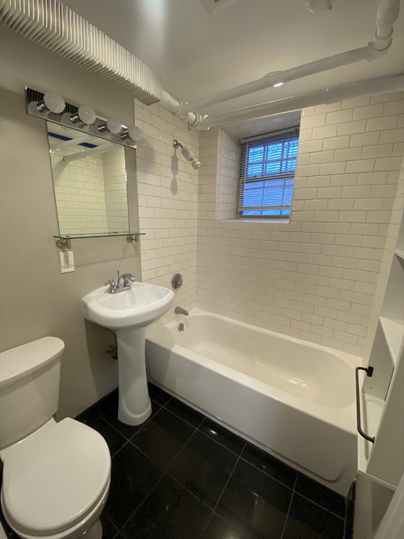 90 Bynner Street, Unit B Boston, MA 02130 - Photo 4 of 15 a bathroom with a sink toilet and shower