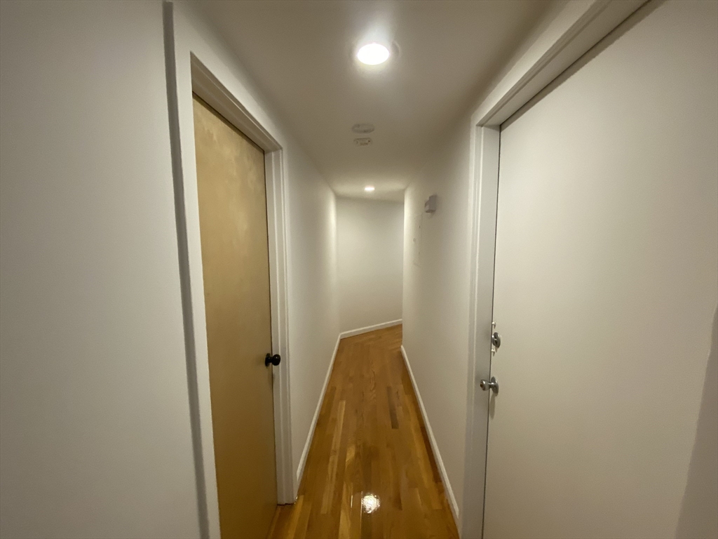 90 Bynner Street, Unit B Boston, MA 02130 - Photo 7 of 15 a view of a hallway with a door