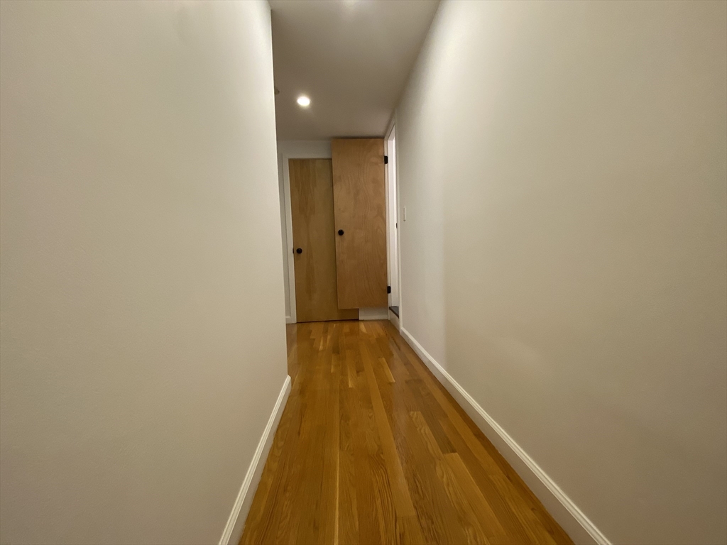 90 Bynner Street, Unit B Boston, MA 02130 - Photo 8 of 15 a view of a bathroom with wooden floor