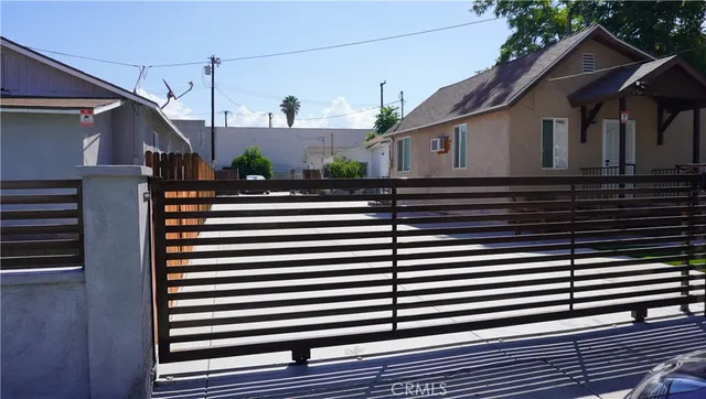 a view of a house with a street