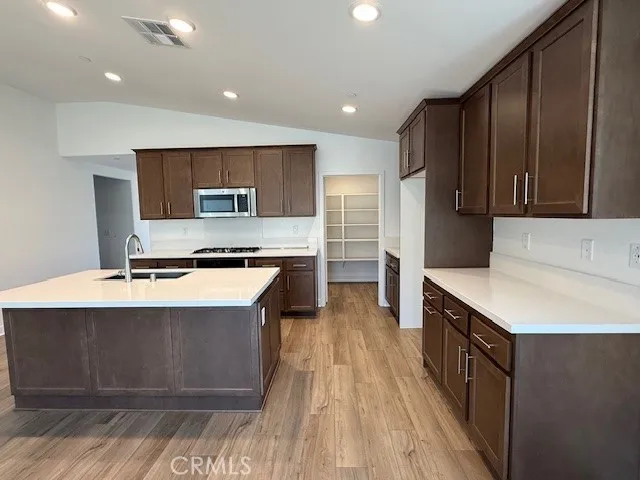 a kitchen with stainless steel appliances granite countertop a stove and a refrigerator