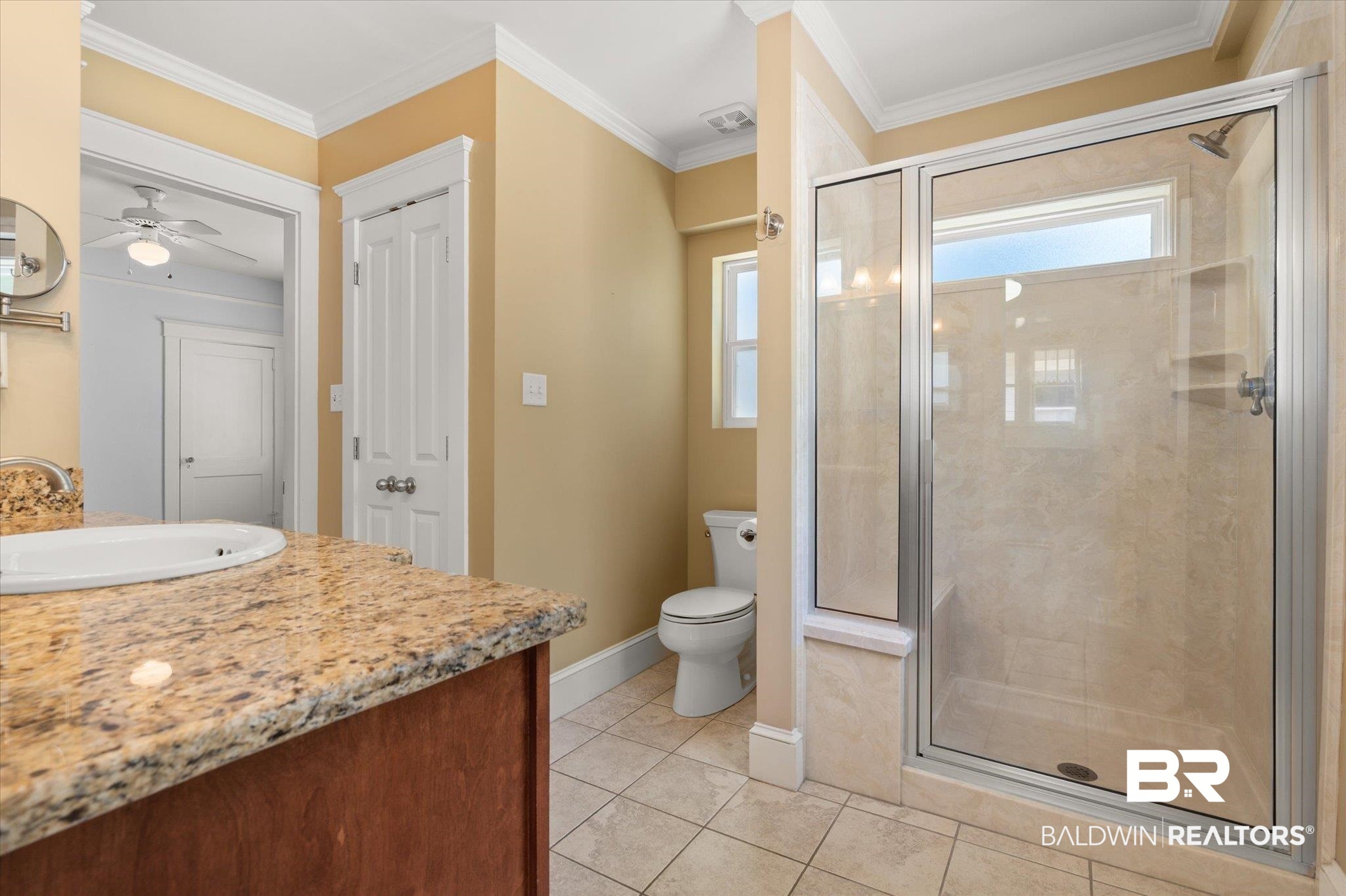 24 Macy Place Mobile, AL 36604 - Photo 26 of 38 Full bathroom with vanity, a shower stall, toilet, baseboards, and tile patterned flooring