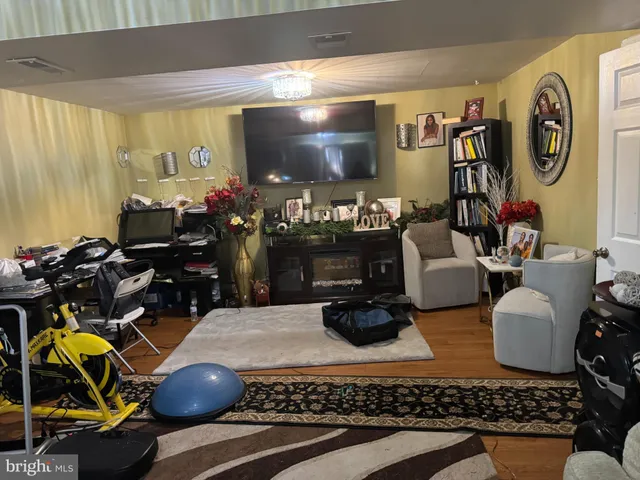 a living room with furniture a rug and a large window