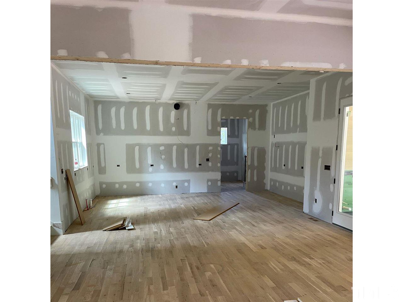4312 Windsor Place Raleigh, NC 27609 - Photo 3 of 7 a living room with furniture and a wooden floor