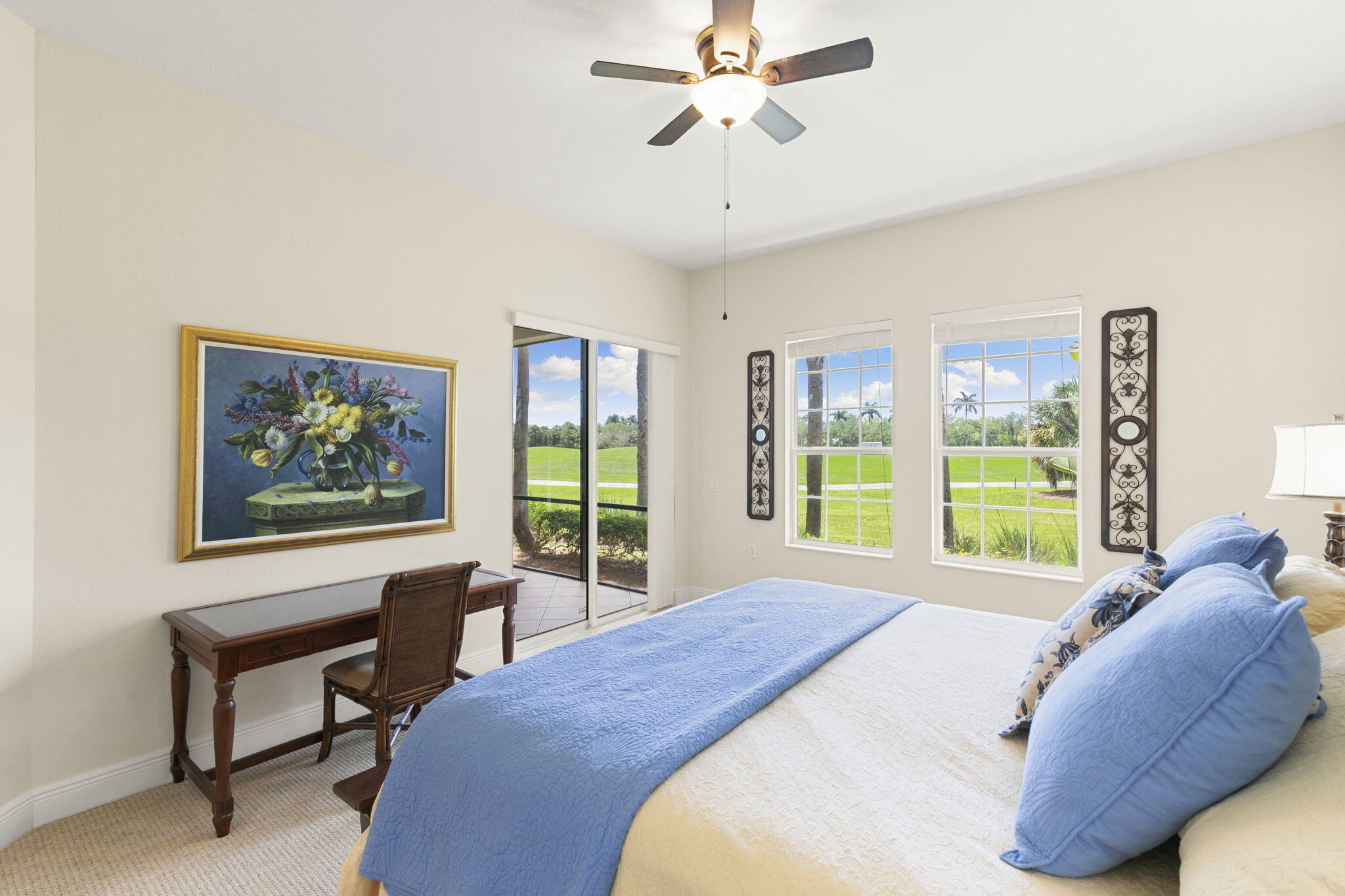 9066 Cascada Way, Unit 101 Naples, FL 34114 - Photo 18 of 51 a bed sitting in a bedroom next to a window