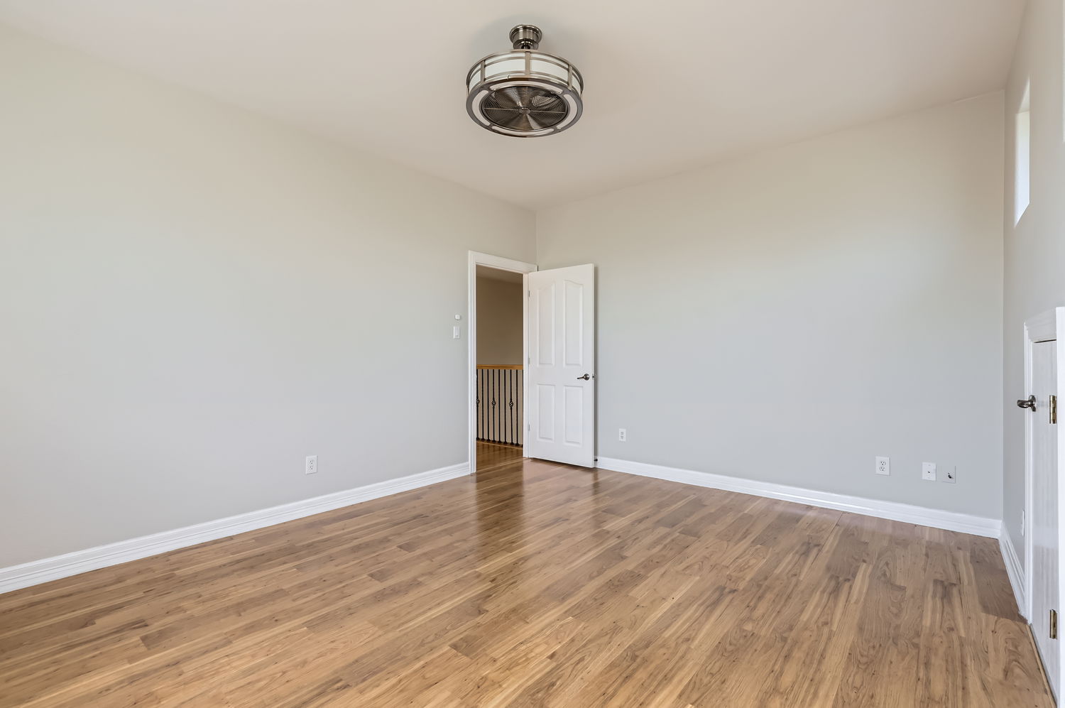 210 Amandas Way Leander, TX 78641 - Photo 27 of 38 Unfurnished bedroom with light wood-style flooring and baseboards