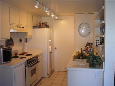 77 Dockside Circle San Rafael, CA 94903 - Photo 3 of 7 a kitchen with stainless steel appliances granite countertop a sink a stove and a refrigerator
