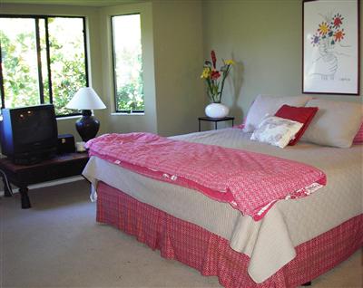 77 Dockside Circle San Rafael, CA 94903 - Photo 6 of 7 a bedroom with a bed and a painting on the wall