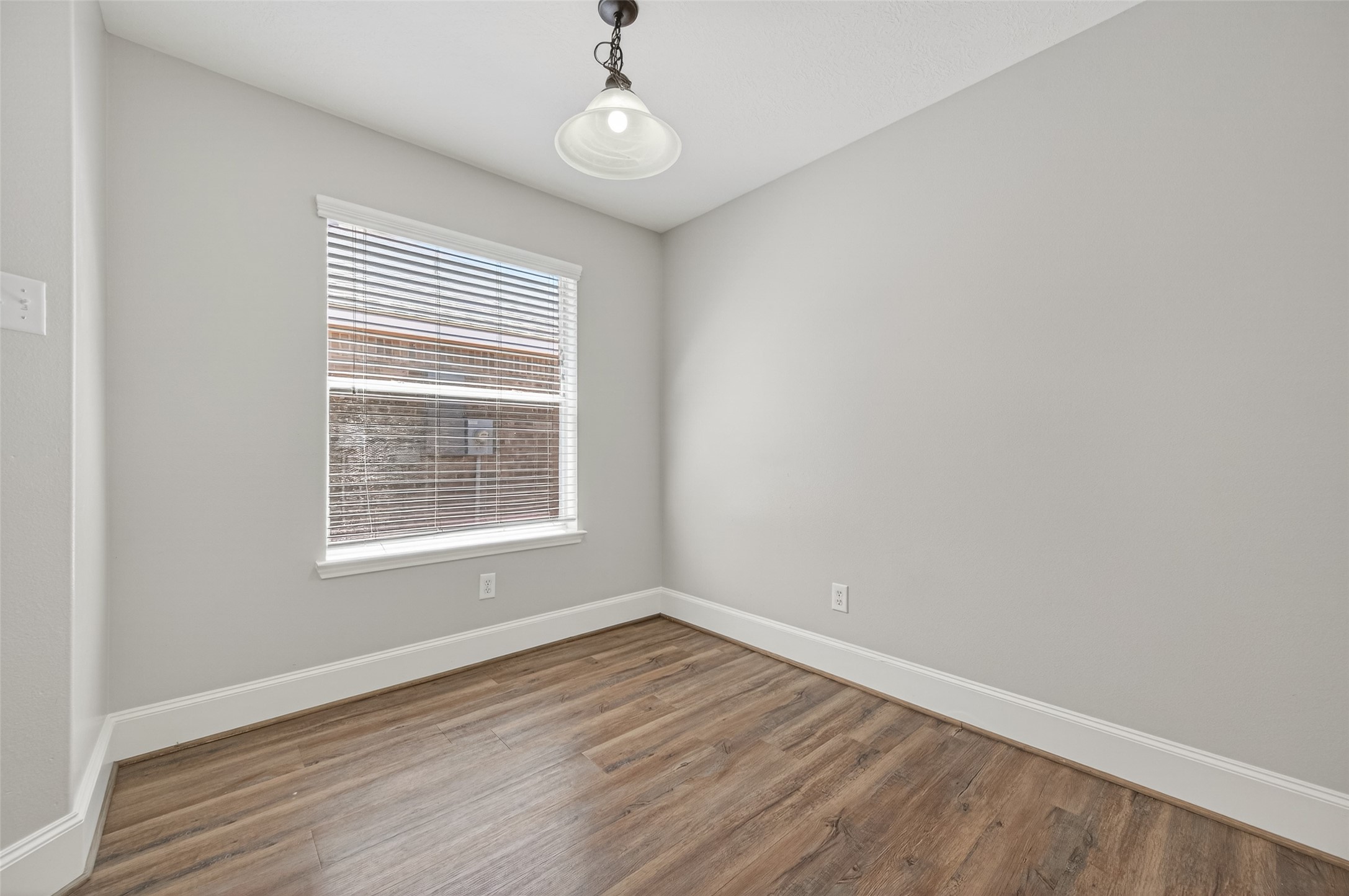 22419 Bridgestone Ridge Drive Spring, TX 77389 - Photo 16 of 48 wooden floor in an empty room with a window
