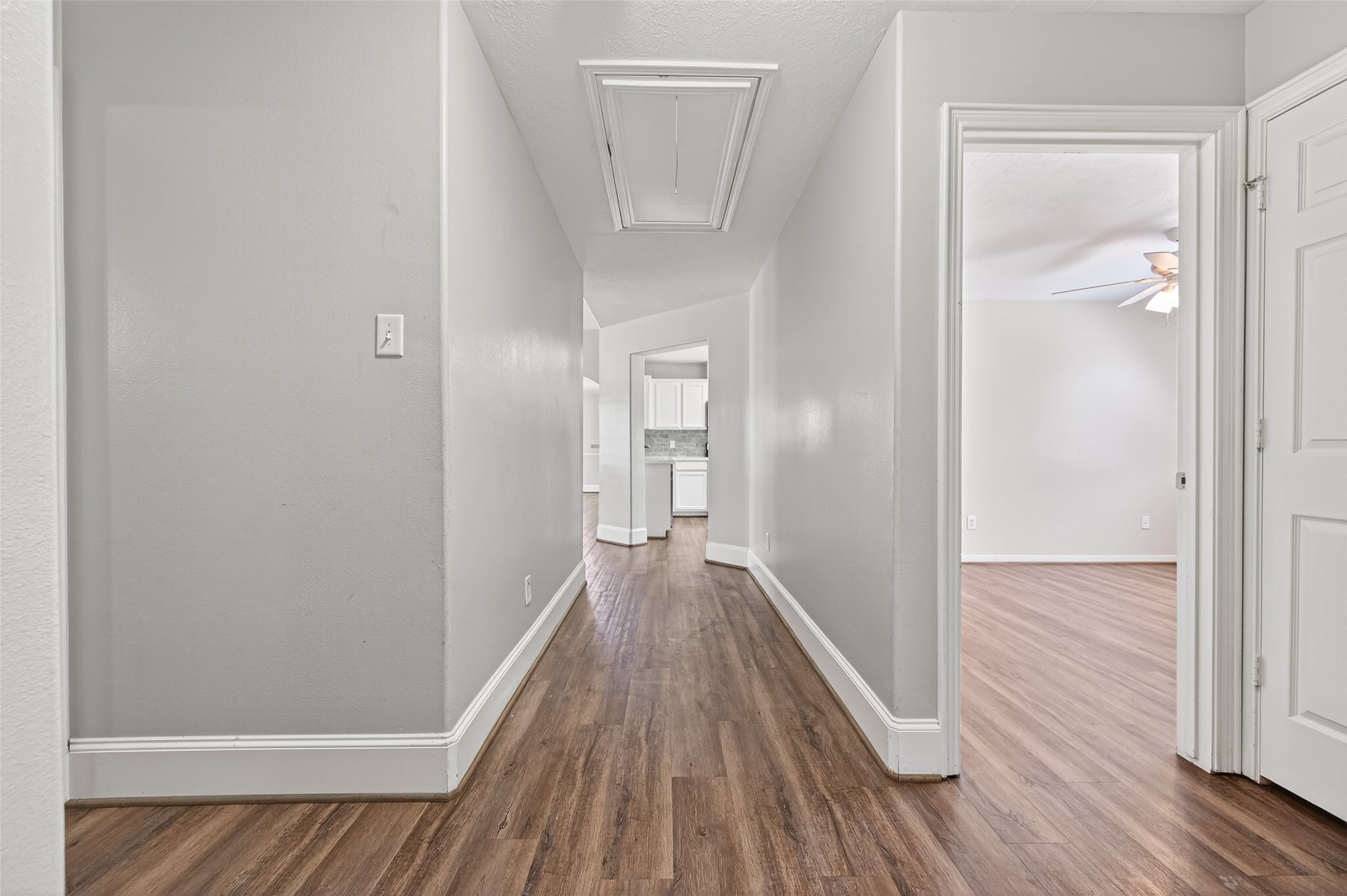 22419 Bridgestone Ridge Drive Spring, TX 77389 - Photo 19 of 48 a view of a hallway with wooden floor
